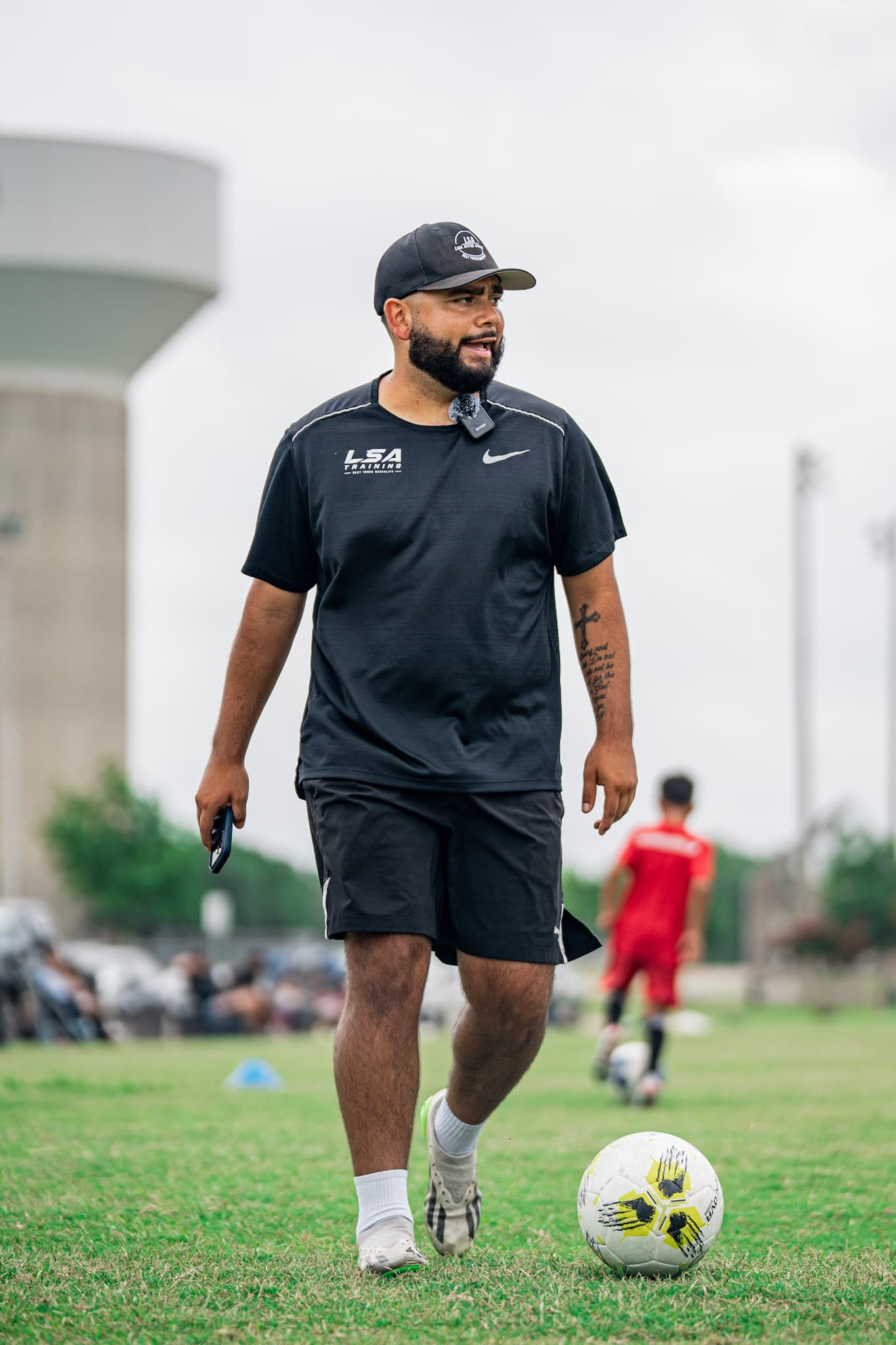 Coach Carlos Lara on the field during a training session